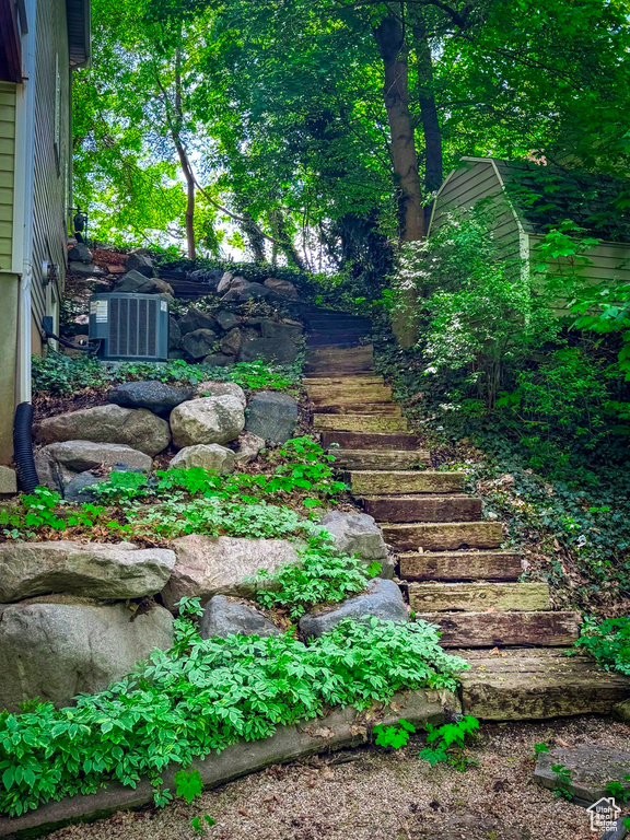 View of yard featuring stairs