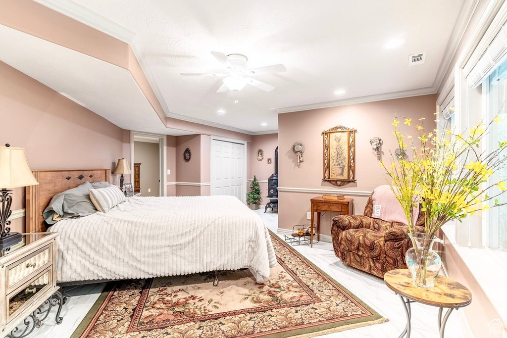 Bedroom featuring ceiling fan, a closet, recessed lighting, and crown molding