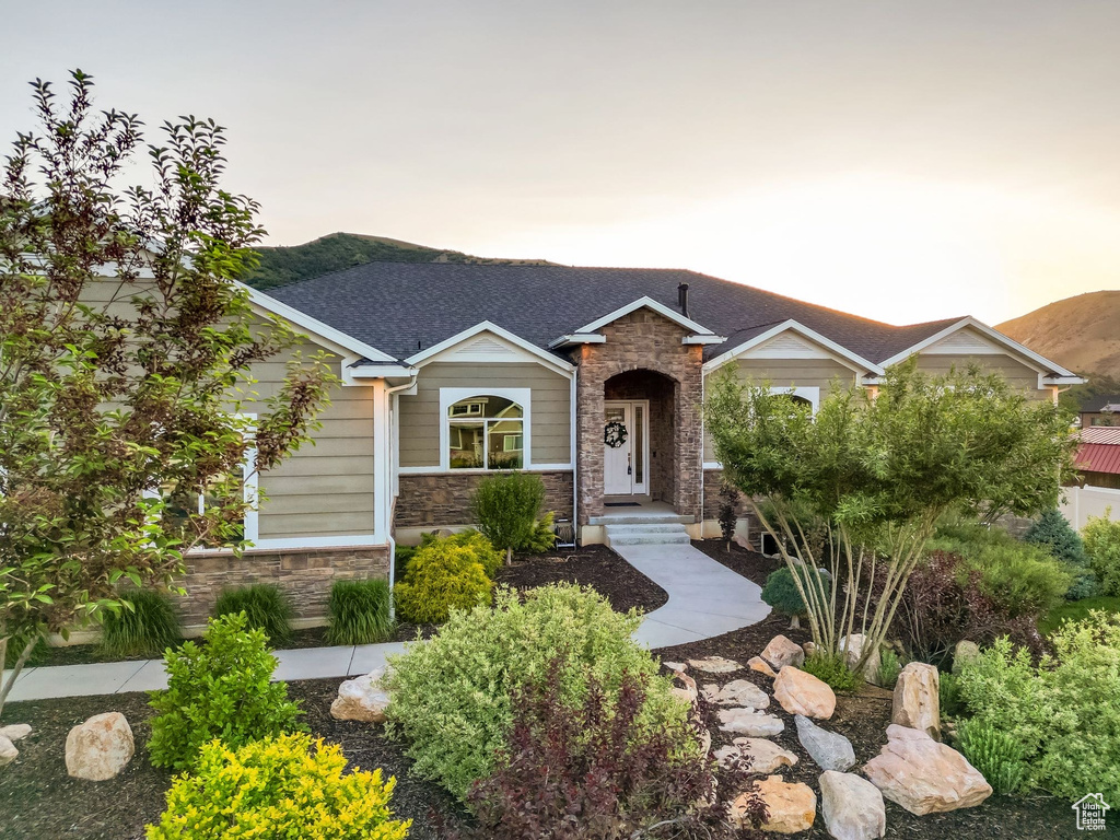Craftsman-style house featuring stone siding