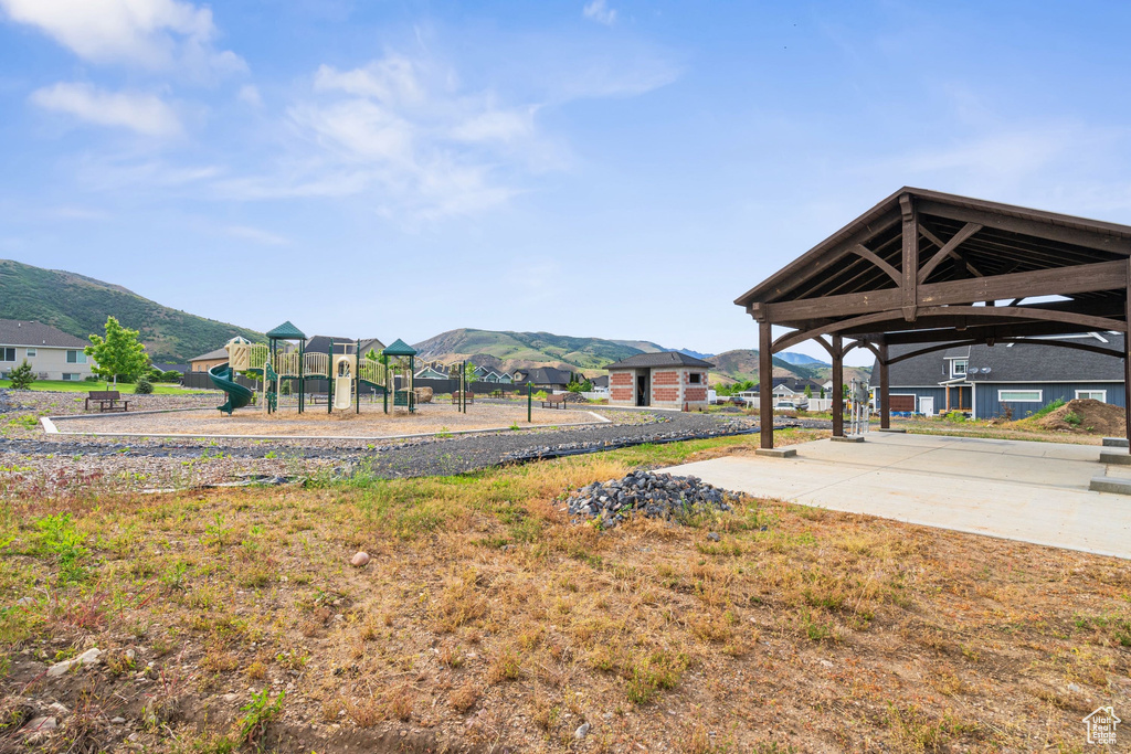 View of yard with a mountain view and a gazebo