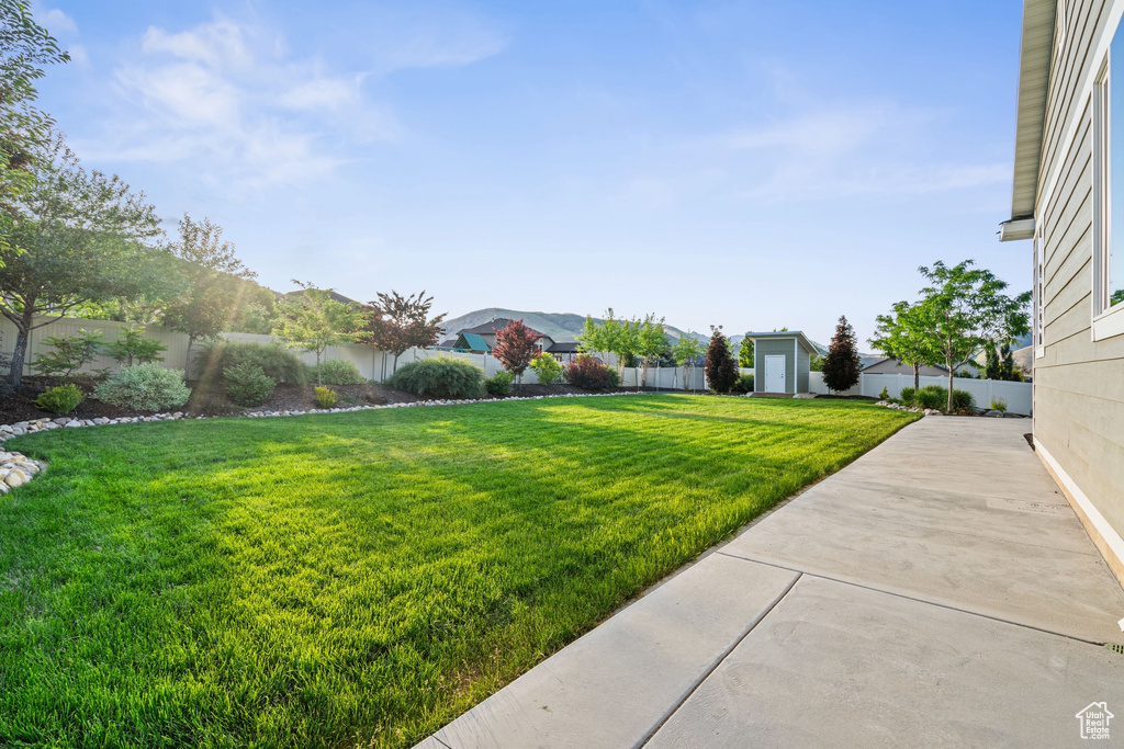 View of yard featuring a patio area and a residential view