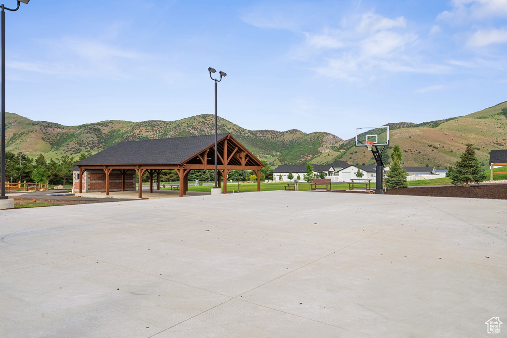 Exterior space featuring a mountain view, a gazebo, and community basketball court