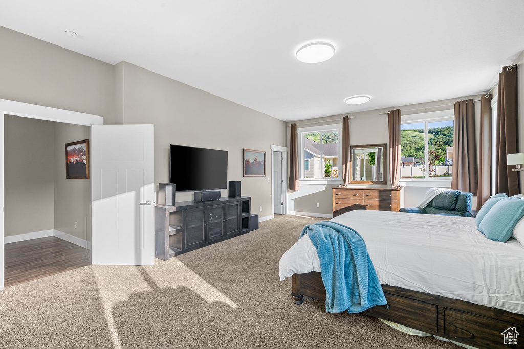 Bedroom featuring baseboards and carpet flooring