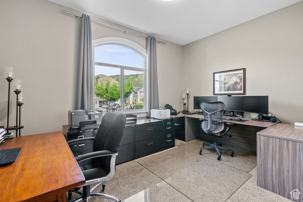 Home office featuring speckled floor