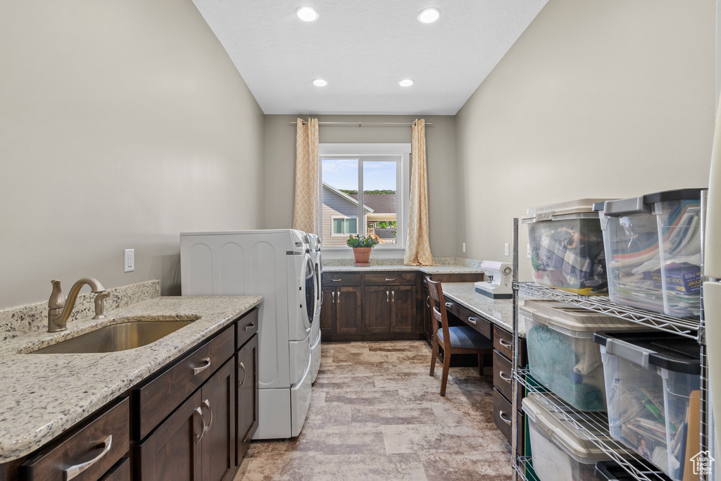 Washroom featuring cabinet space, recessed lighting, and separate washer and dryer