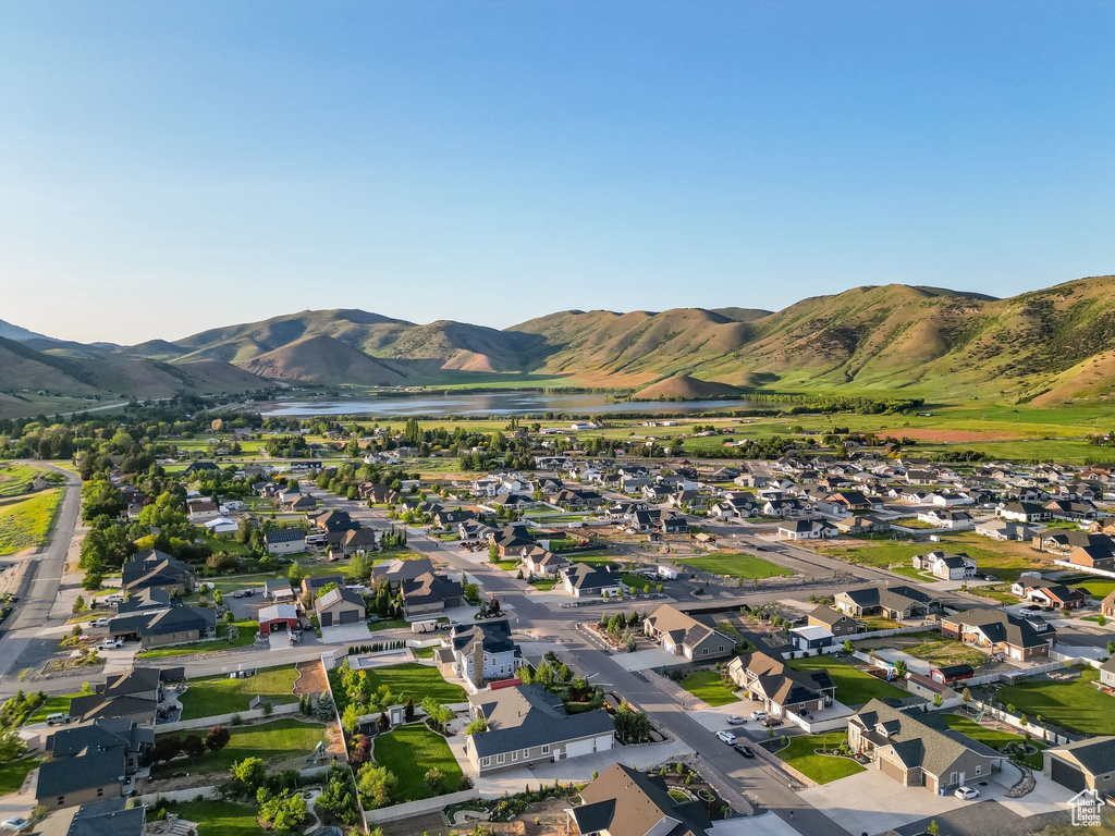 Mountain view with a large body of water and nearby suburban area