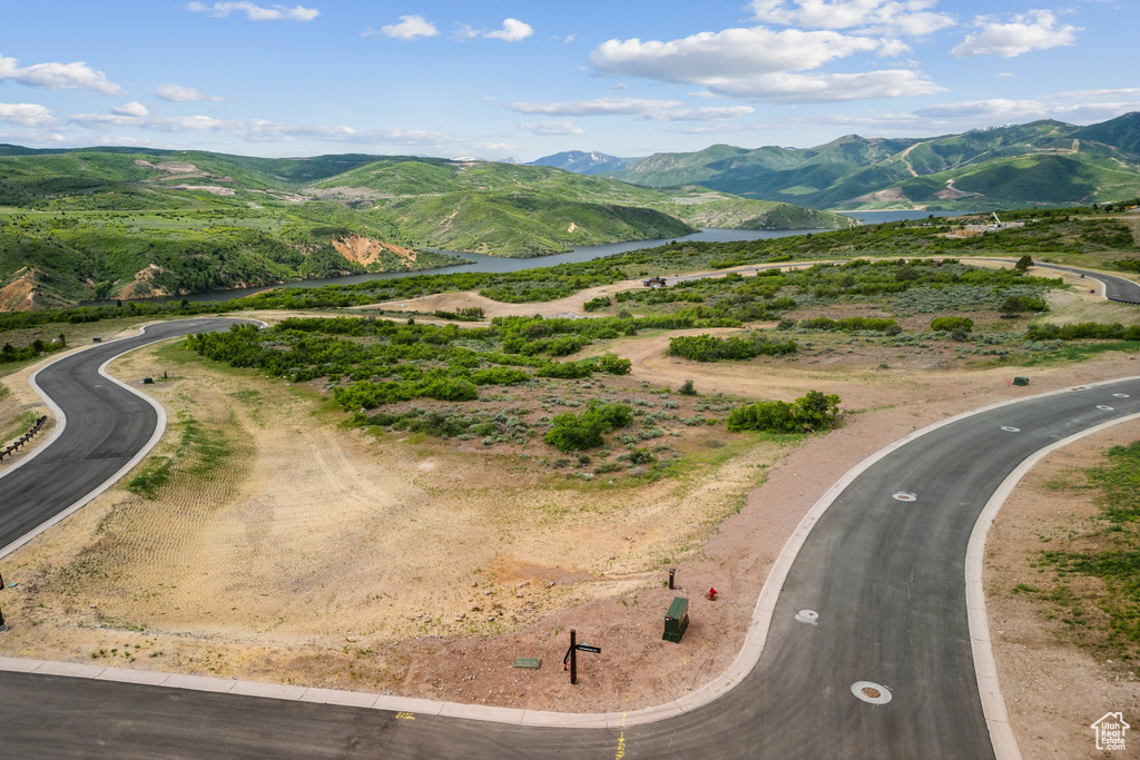 View of property location with a water and mountain view