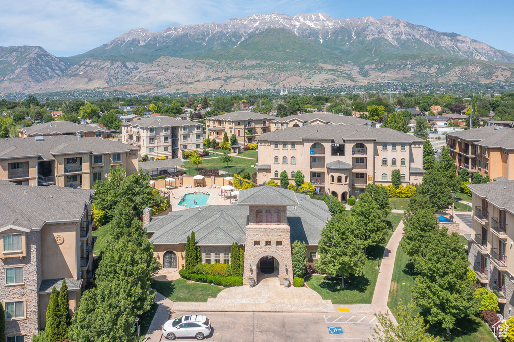 Aerial view of a mountainous background and a pool
