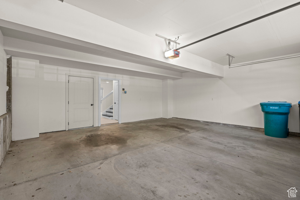 Garage featuring a garage door opener
