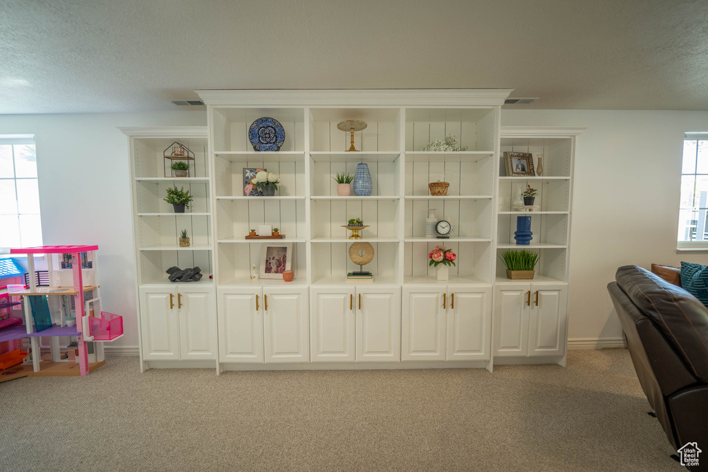 Detailed view of carpet floors and baseboards