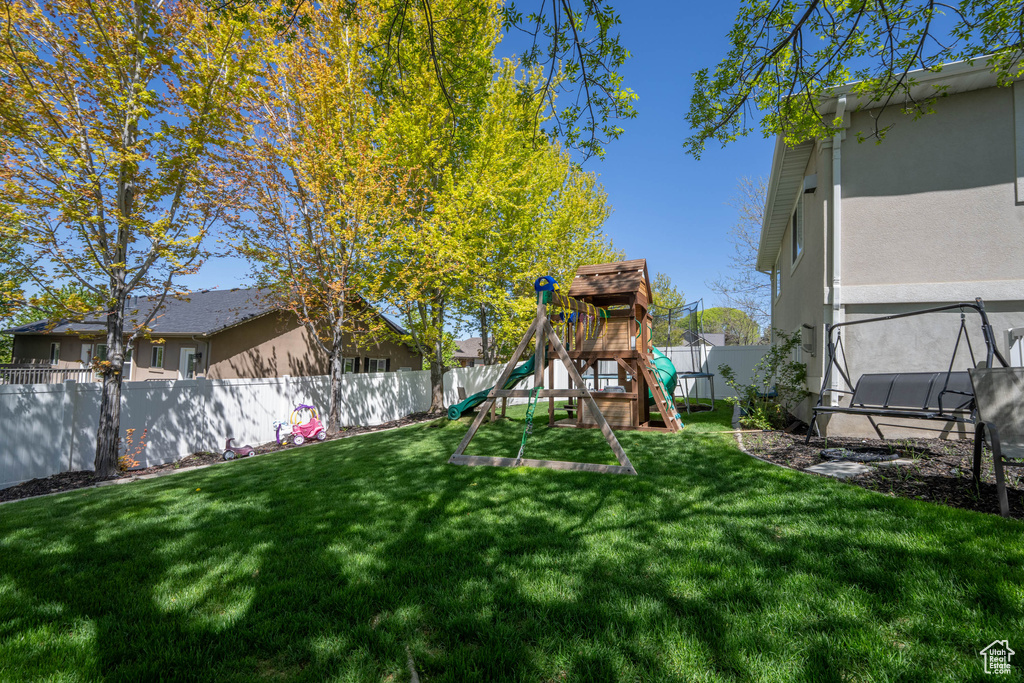View of yard featuring a playground