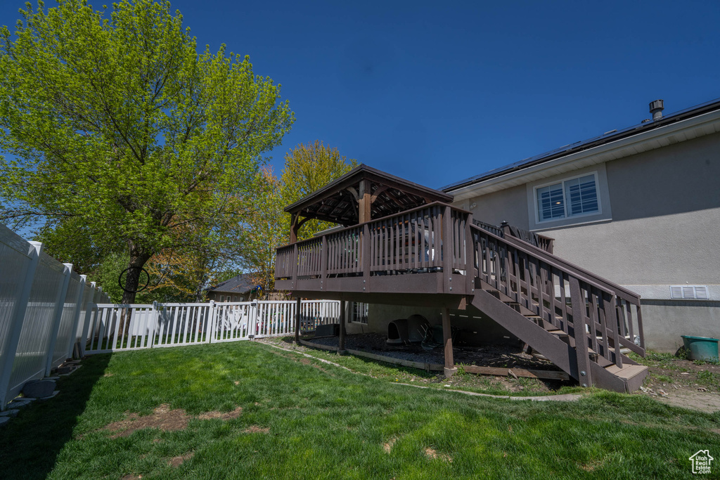 View of yard featuring stairs and a deck