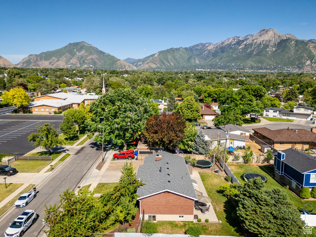 Aerial perspective of suburban area with a mountainous background