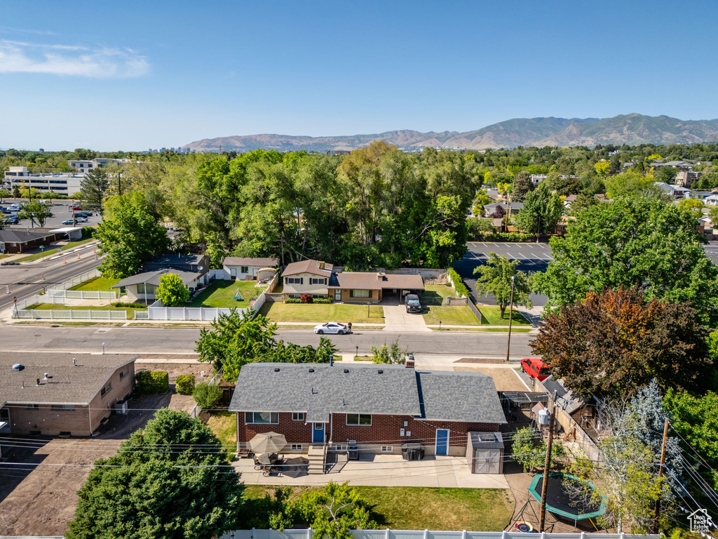 Aerial perspective of suburban area with a mountain backdrop
