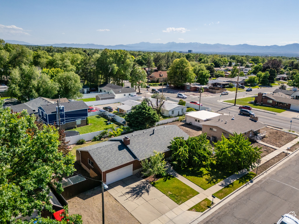 Aerial perspective of suburban area featuring a mountainous background