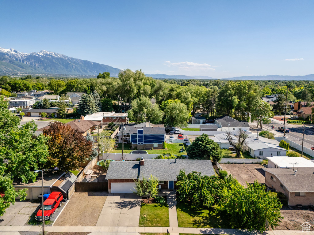Aerial perspective of suburban area with a mountain backdrop