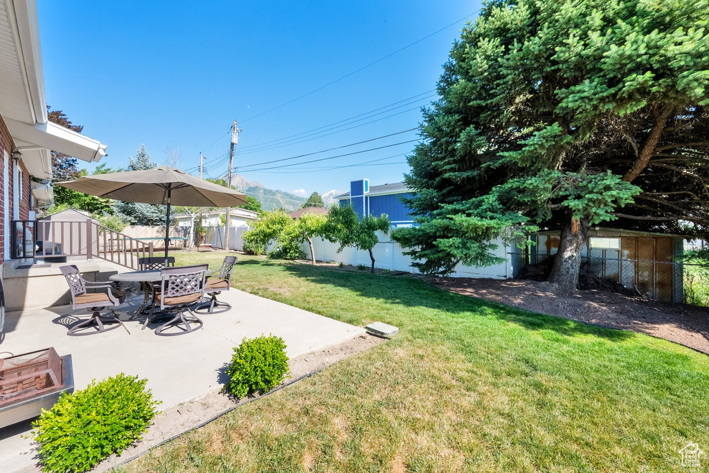View of yard with a patio