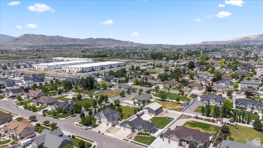 Aerial overview of property's location with a mountainous background
