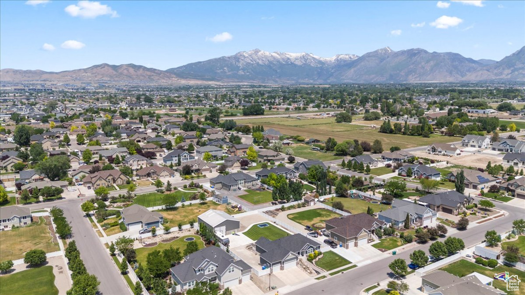 Aerial view of residential area featuring a mountain backdrop
