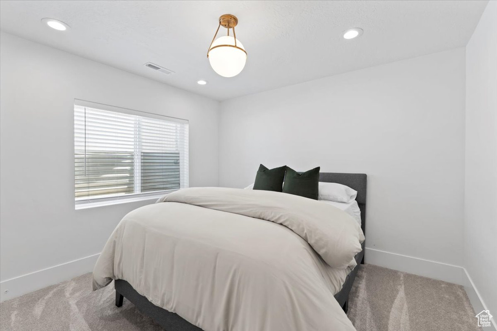 Bedroom featuring carpet flooring, baseboards, and recessed lighting