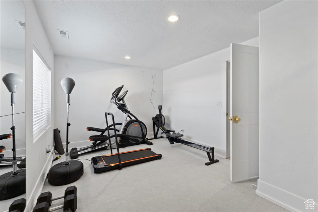 Workout room featuring baseboards, recessed lighting, and carpet flooring