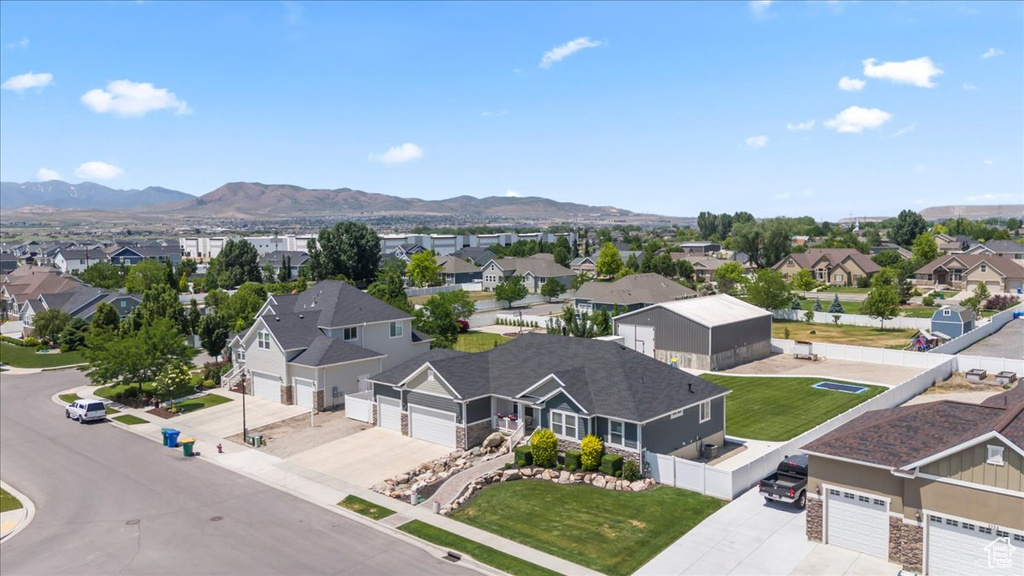 Aerial perspective of suburban area with a mountain backdrop
