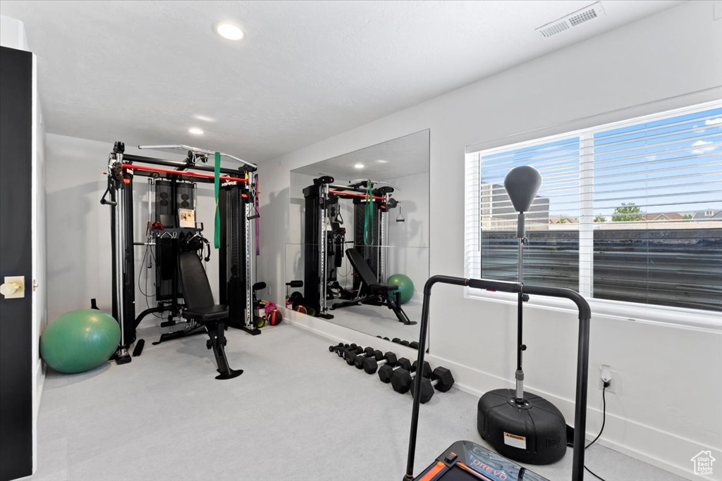 Exercise area with carpet flooring, recessed lighting, and baseboards