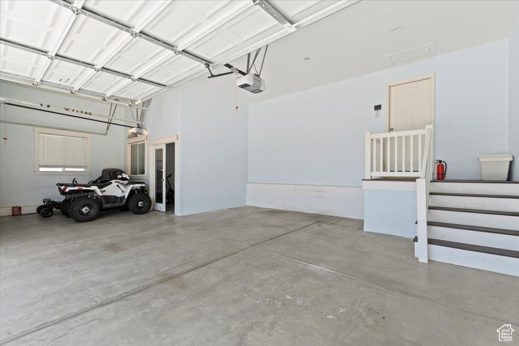 Garage featuring a garage door opener