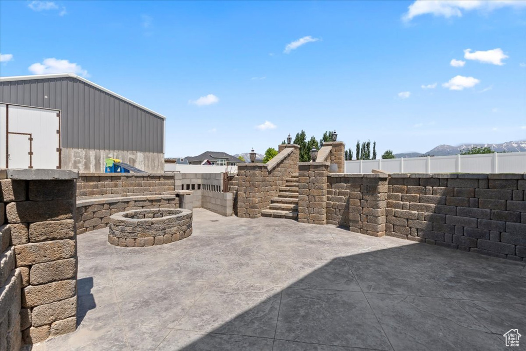 View of patio / terrace with an outdoor fire pit