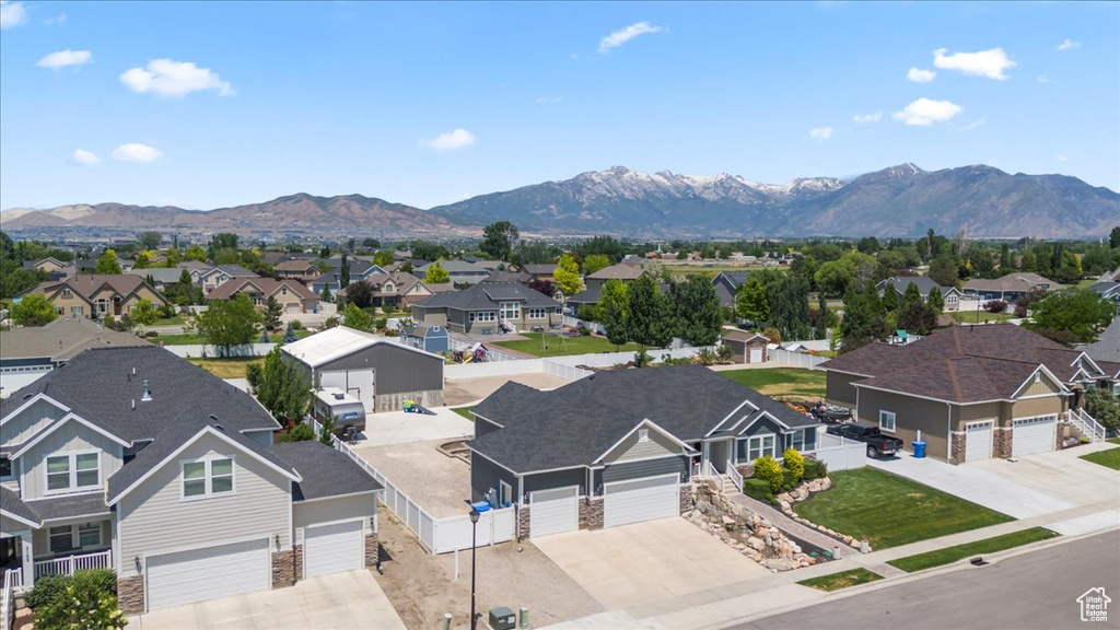 Aerial view of residential area featuring mountains
