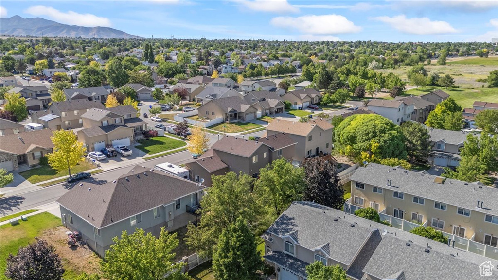 Aerial perspective of suburban area featuring a mountain backdrop