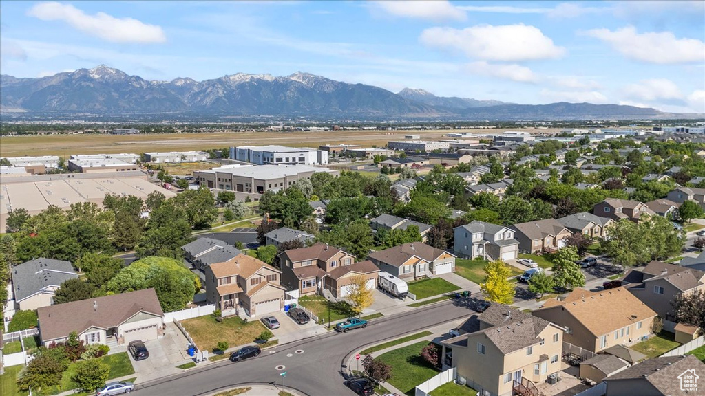 Aerial perspective of suburban area featuring a mountain backdrop