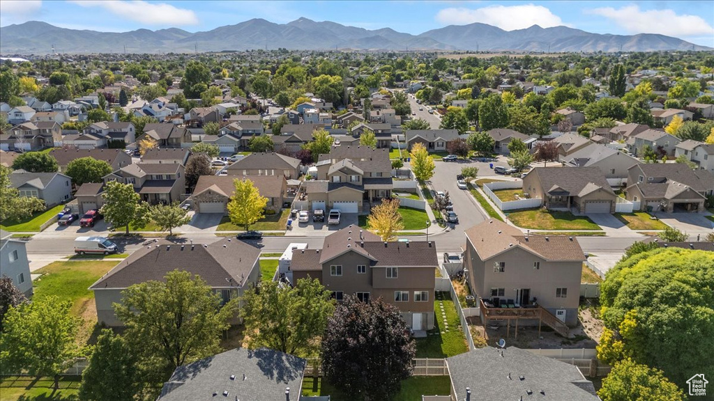 Aerial perspective of suburban area with a mountainous background