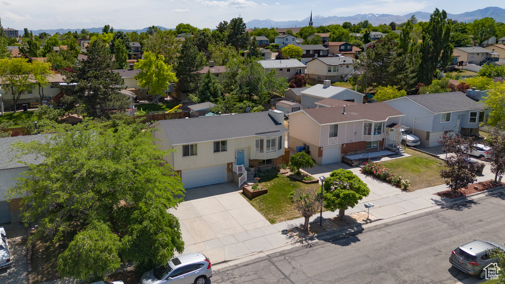 Aerial perspective of suburban area with a mountain backdrop