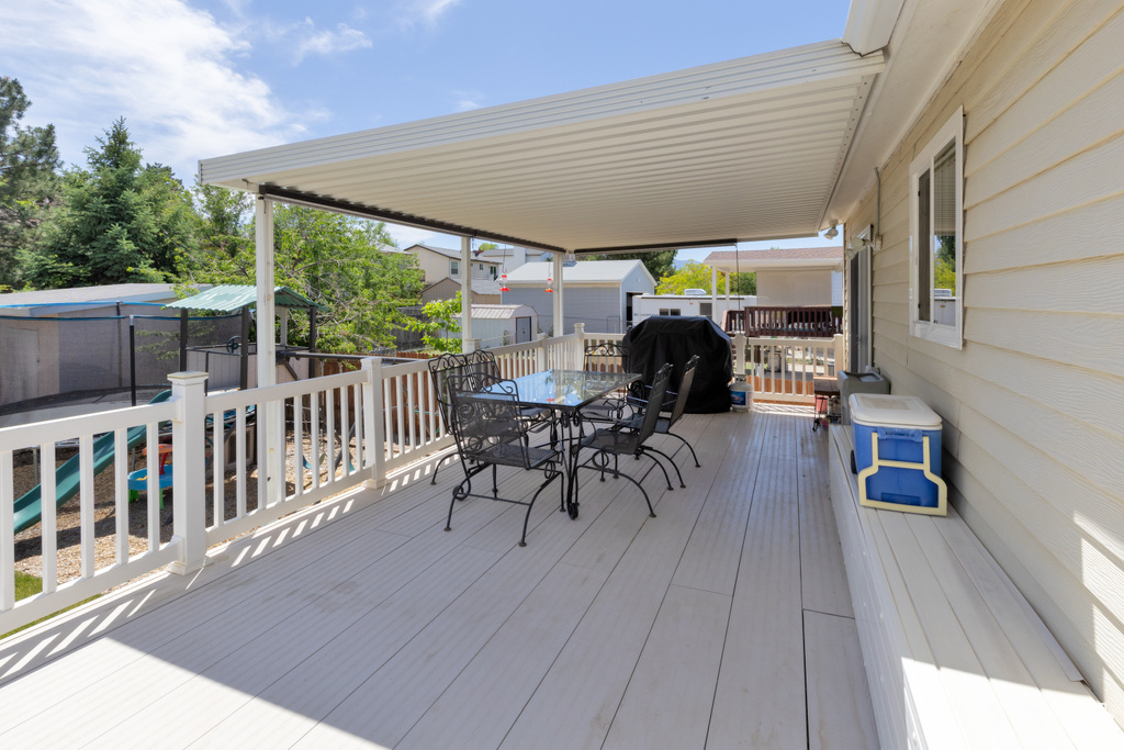 Wooden terrace featuring outdoor dining space