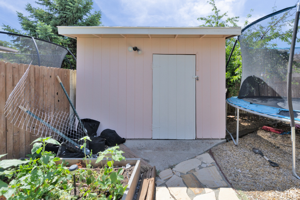 View of shed featuring a trampoline