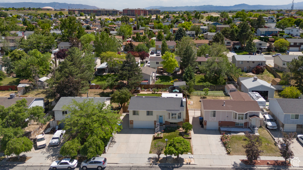 Aerial view of residential area featuring mountains