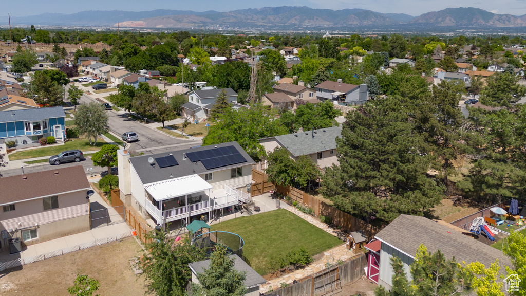Aerial view of residential area featuring a mountainous background