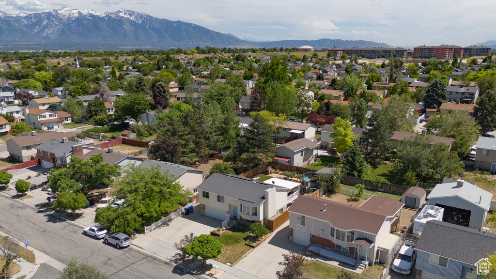 Aerial perspective of suburban area with a mountainous background