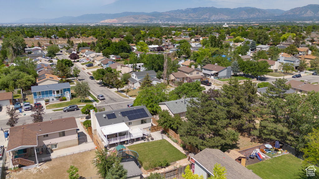 Aerial view of residential area featuring a mountainous background