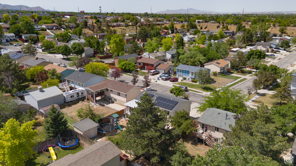 Aerial view of residential area with a mountain backdrop