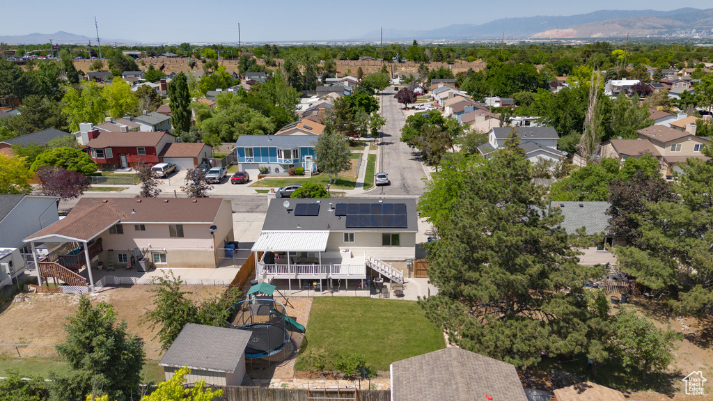 Aerial perspective of suburban area featuring a mountain backdrop