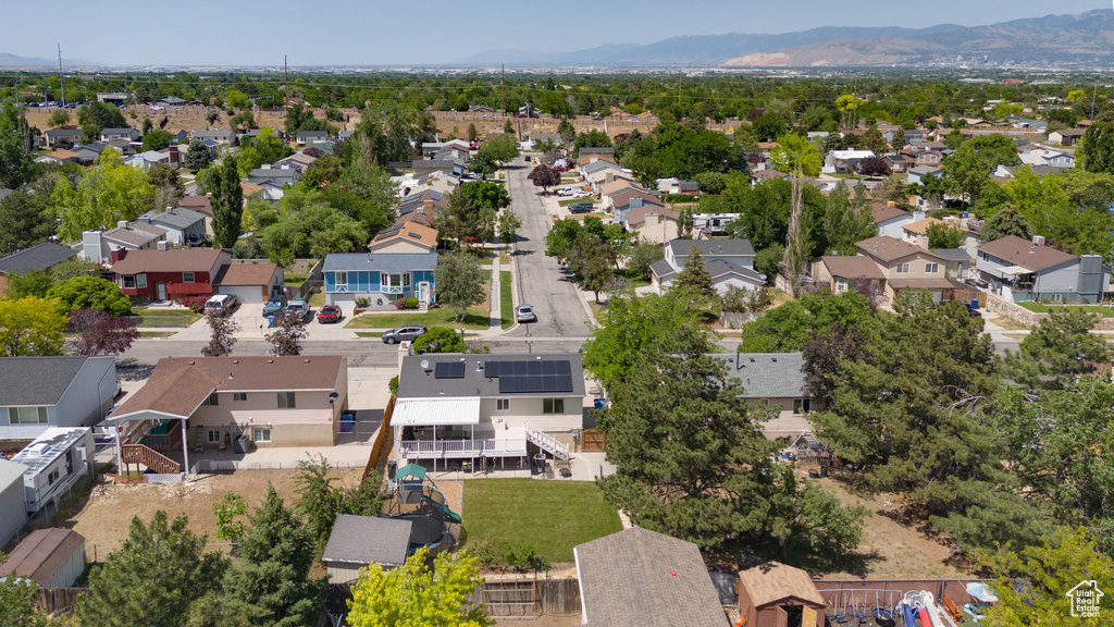 Aerial perspective of suburban area with a mountainous background
