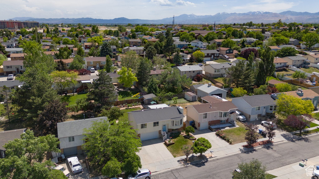Aerial perspective of suburban area featuring a mountainous background
