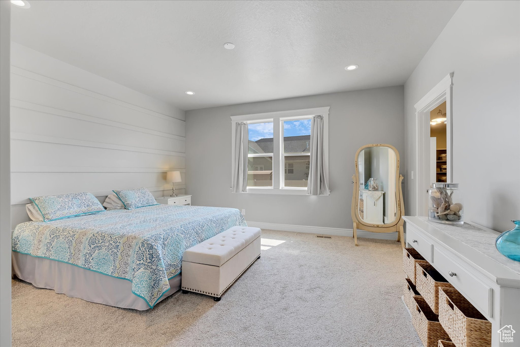 Bedroom with carpet, recessed lighting, and baseboards