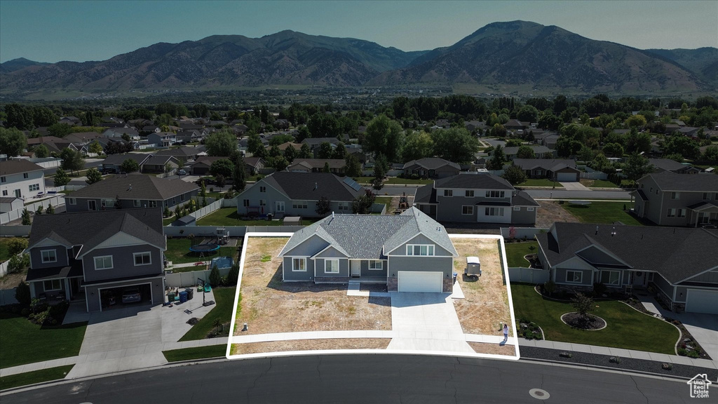 Aerial perspective of suburban area with mountains and property boundaries highlighted