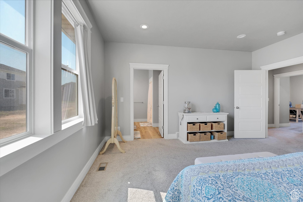 Bedroom featuring carpet, baseboards, and recessed lighting