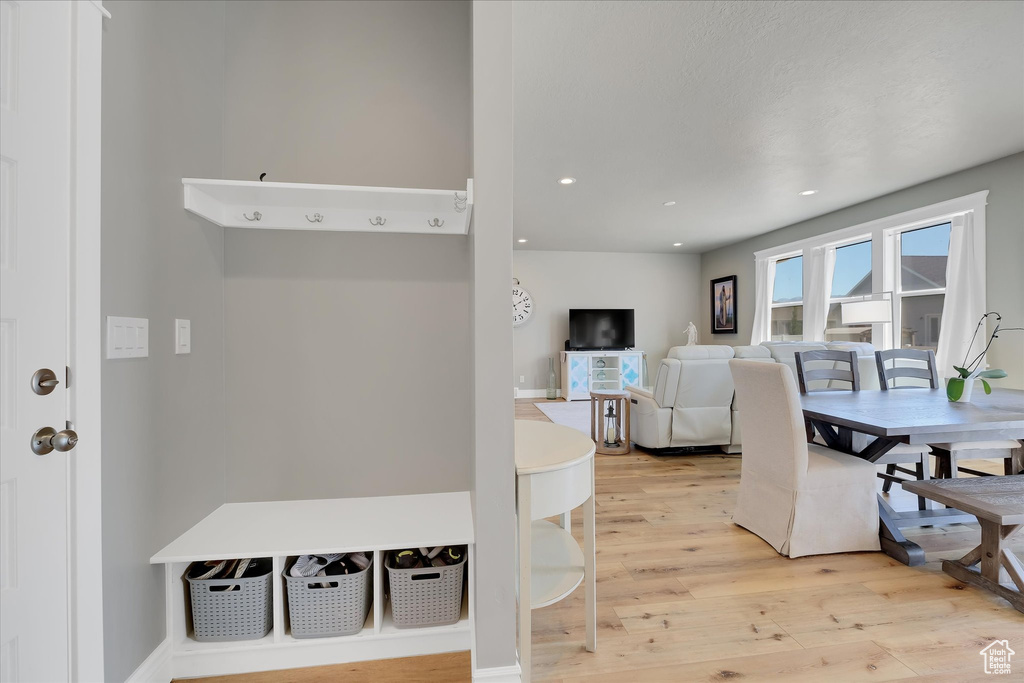 Dining room featuring light wood-style flooring and recessed lighting