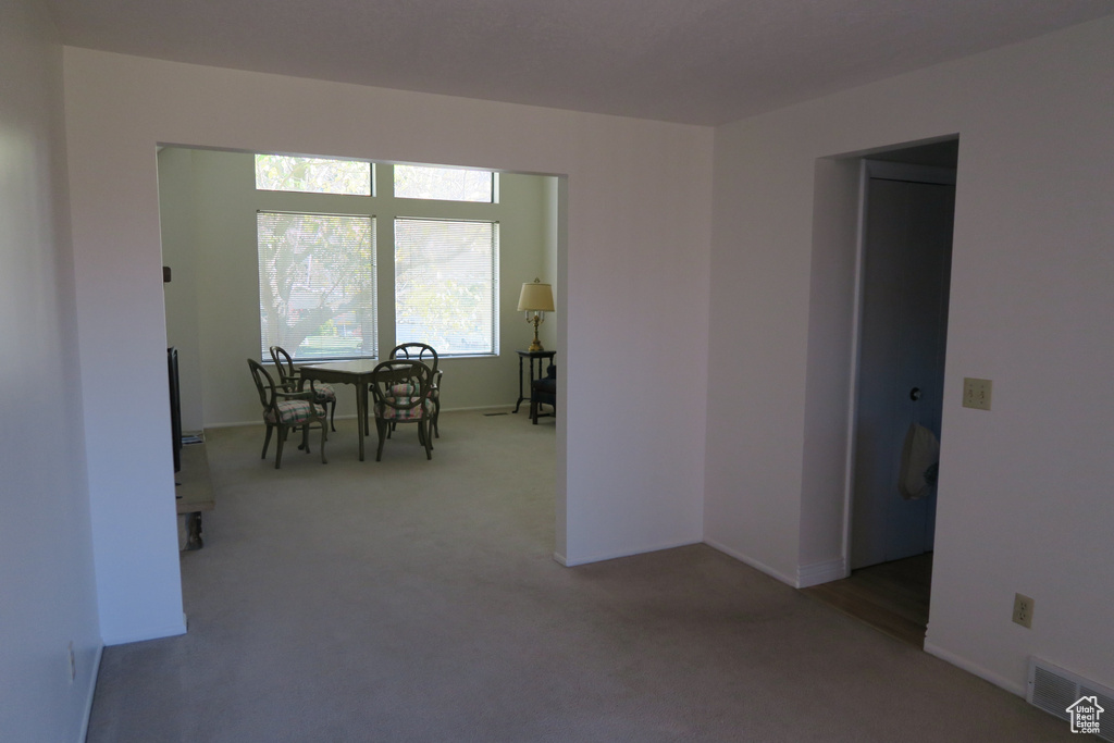 Dining area with carpet flooring and baseboards