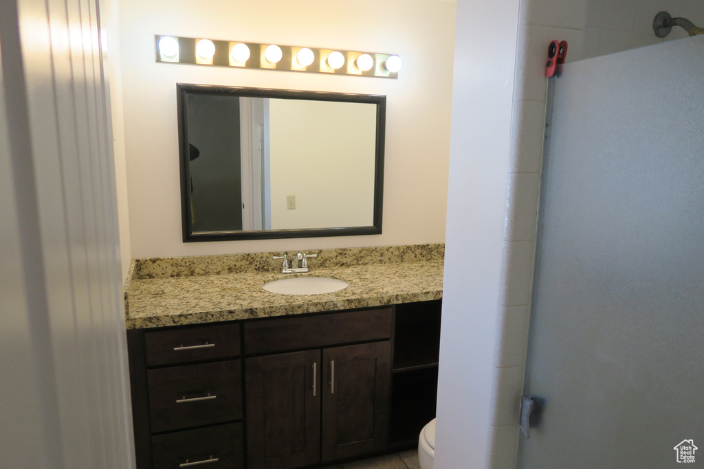 Bathroom featuring vanity and toilet